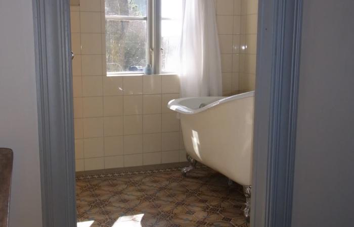 A period octagon ceramic with cabochons in a Gotland, Sweden bathroom 