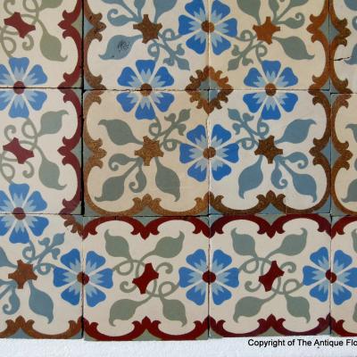 A small 8.5m2 French floral themed antique ceramic floor