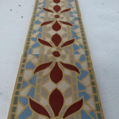 A run of 70+ faux mosaic themed ceramic border tiles 