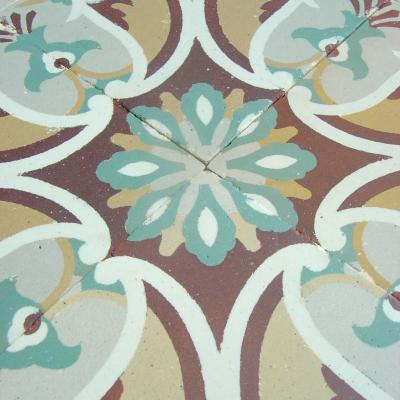 Antique French ceramic floor c.1915 - richly stylised in warm reds