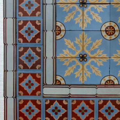 A quality c.24m2 antique ceramic floor with original borders produced by Douvrin c.1900