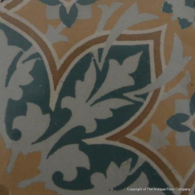An 11.5m2+ vegetal themed antique French ceramic floor with triple borders