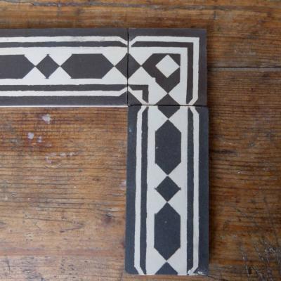 Antique French black and white ceramic half size border tiles