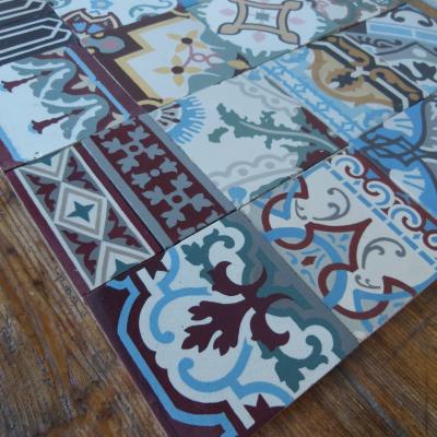 Patchwork of 20 antique French and Belgian ceramic tiles