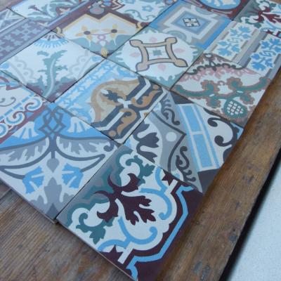 Patchwork of 20 antique French and Belgian ceramic tiles