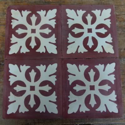 Four antique Carreaux de ciments tiles in bordeaux and white