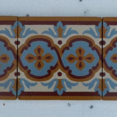 A large run of antique Maubeuge border tiles plus corners